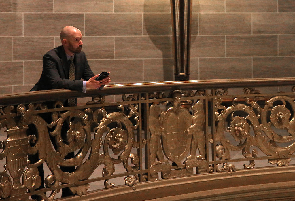 Jamie Morris stands against a ledge in the Missouri State Capitol building